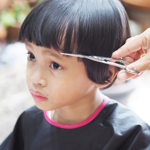 young child getting a hair cut